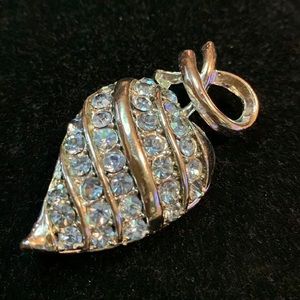 Silver and blue gemstone brooch